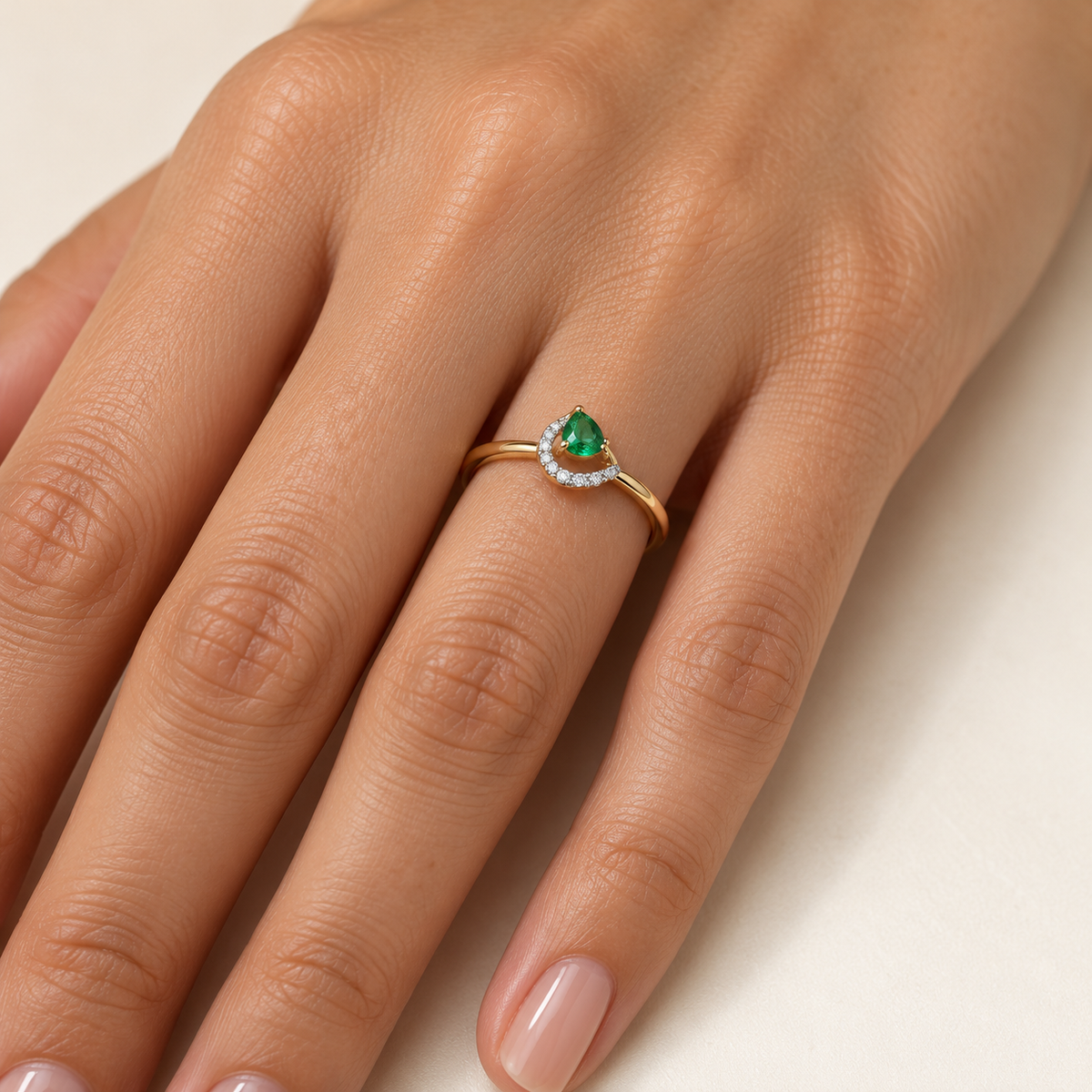 green pear-shaped ring
