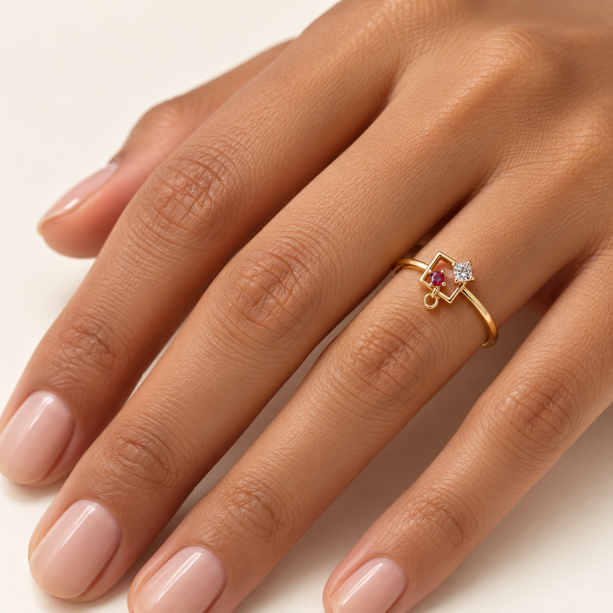 open-frame gold ring with ruby accent