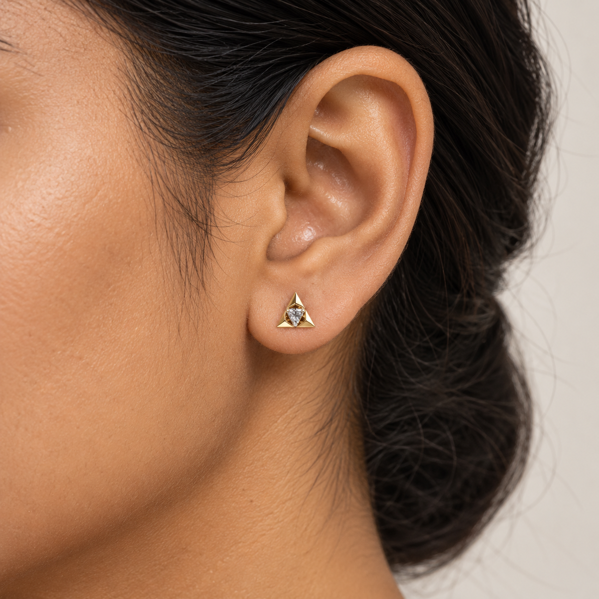delicate triangular gold stud earrings