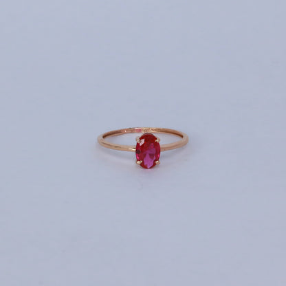 18KT GOLD OVAL RED GEM RING