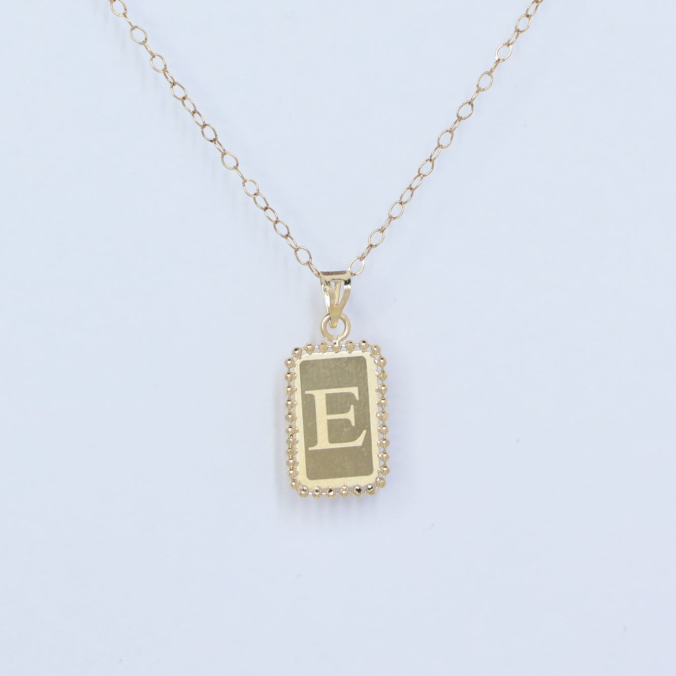 rectangle letter e 18kt gold pendant