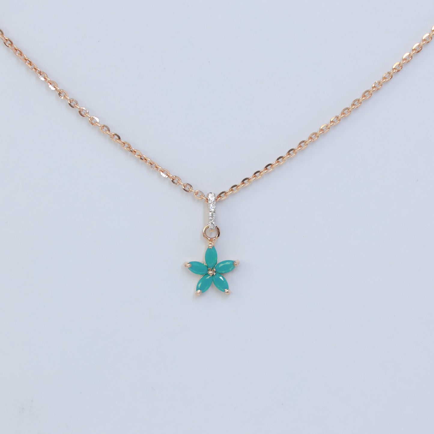 18kt gold teal blue flower cz pendant