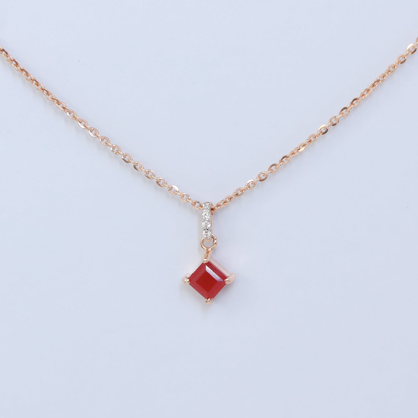 18kt gold red stone studded cz pendant